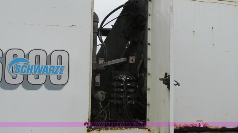 image for item G2173 2003 Freightliner FL70 truck with Schwarze M6000 sweeper