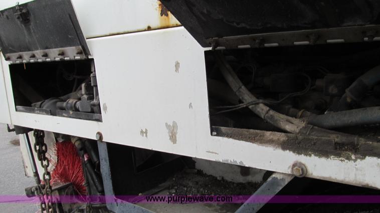 image for item G2173 2003 Freightliner FL70 truck with Schwarze M6000 sweeper