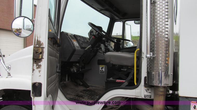 image for item G2173 2003 Freightliner FL70 truck with Schwarze M6000 sweeper