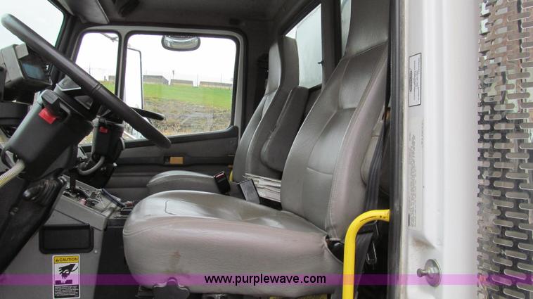 image for item G2173 2003 Freightliner FL70 truck with Schwarze M6000 sweeper