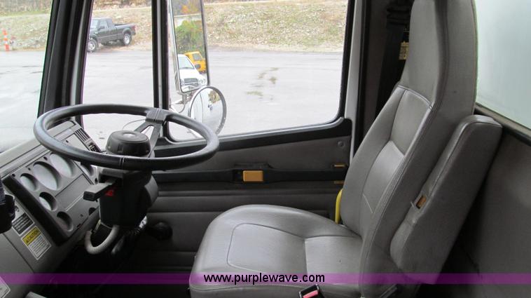 image for item G2173 2003 Freightliner FL70 truck with Schwarze M6000 sweeper