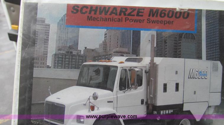 image for item G2173 2003 Freightliner FL70 truck with Schwarze M6000 sweeper