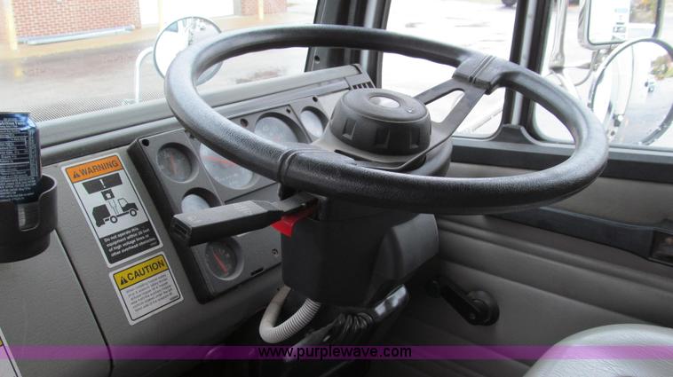 image for item G2173 2003 Freightliner FL70 truck with Schwarze M6000 sweeper