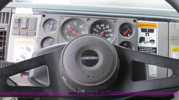 image for item G2173 2003 Freightliner FL70 truck with Schwarze M6000 sweeper