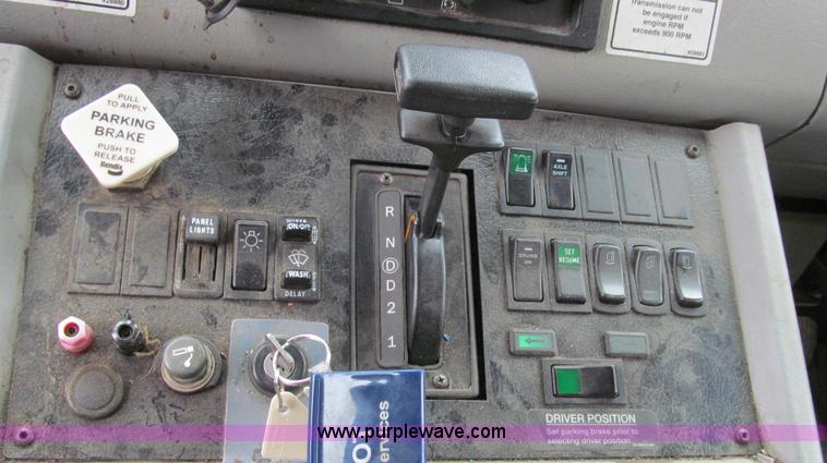 image for item G2173 2003 Freightliner FL70 truck with Schwarze M6000 sweeper