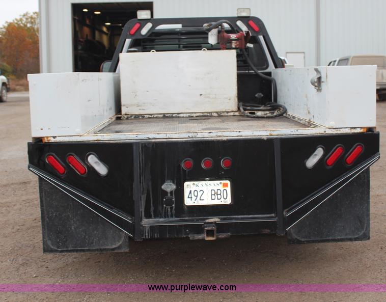image for item H7959 2003 Ford F350 Super Duty XLT SuperCab flatbed pickup truck