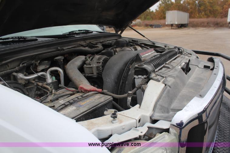 image for item H7959 2003 Ford F350 Super Duty XLT SuperCab flatbed pickup truck