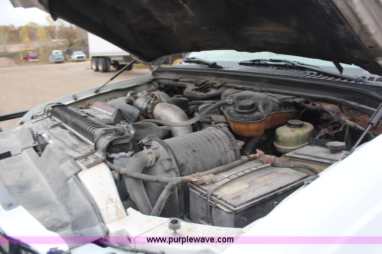 image for item H7959 2003 Ford F350 Super Duty XLT SuperCab flatbed pickup truck