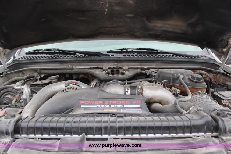 image for item H7959 2003 Ford F350 Super Duty XLT SuperCab flatbed pickup truck