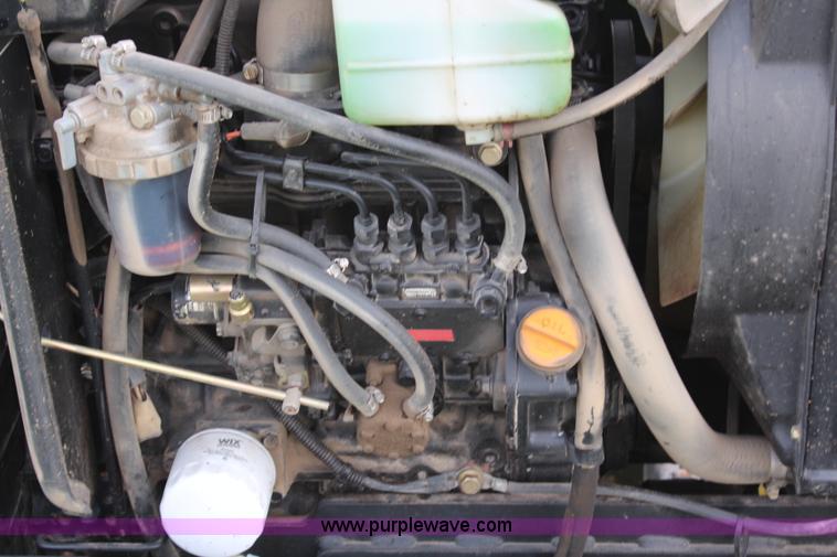 image for item H7971 2002 John Deere 4610 MFWD tractor