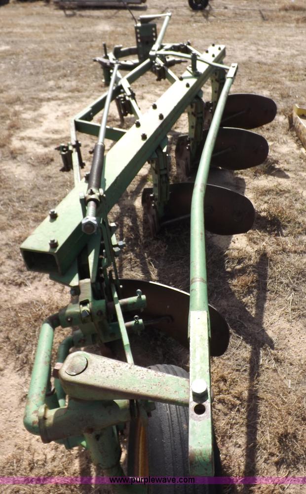 John Deere four bottom plow in Deerfield, KS Item I8306 sold Purple