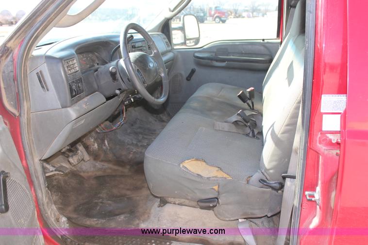 image for item H7876 2004 Ford F350 Crew Cab flatbed pickup truck