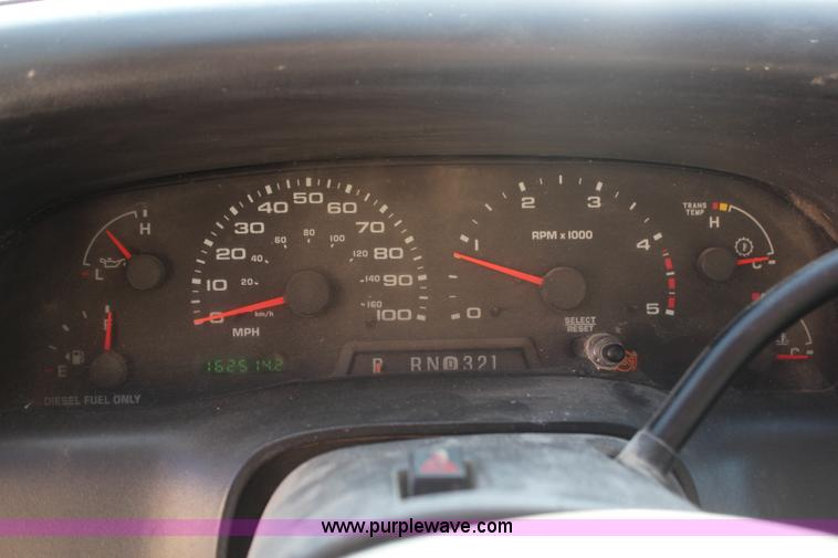 image for item H7876 2004 Ford F350 Crew Cab flatbed pickup truck