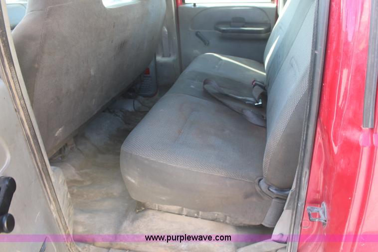 image for item H7876 2004 Ford F350 Crew Cab flatbed pickup truck