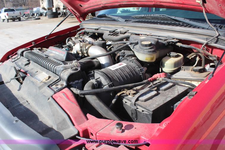 image for item H7876 2004 Ford F350 Crew Cab flatbed pickup truck