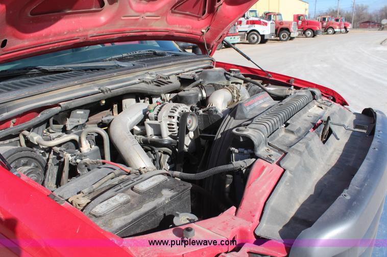 image for item H7876 2004 Ford F350 Crew Cab flatbed pickup truck