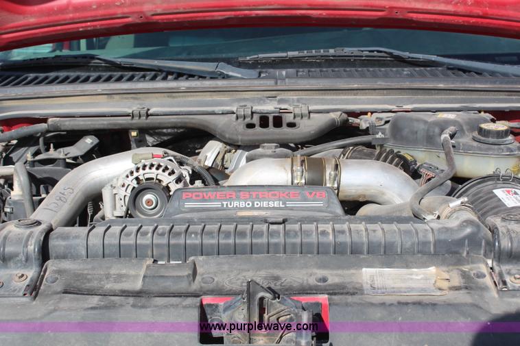 image for item H7876 2004 Ford F350 Crew Cab flatbed pickup truck