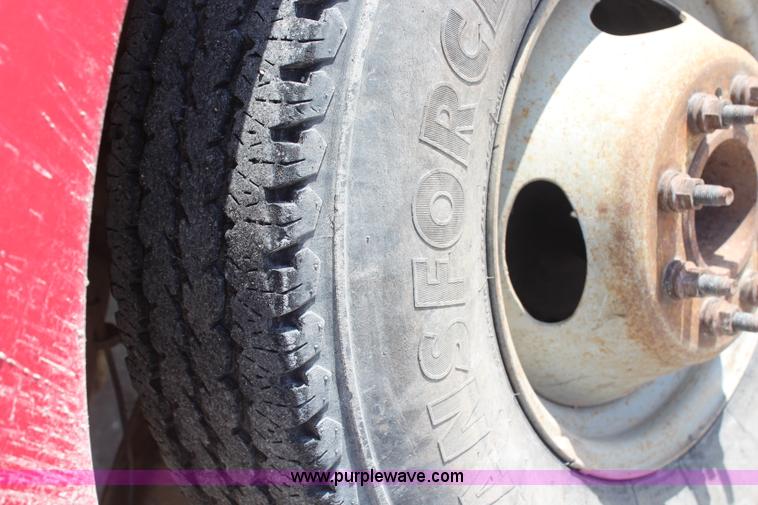 image for item H7876 2004 Ford F350 Crew Cab flatbed pickup truck