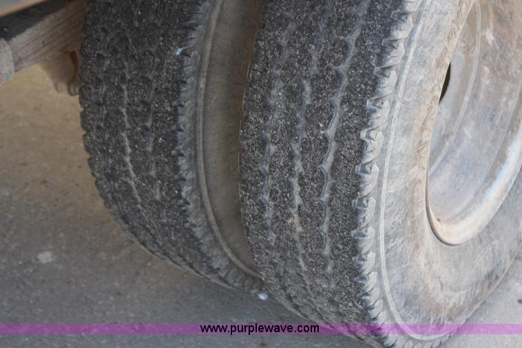 image for item H7876 2004 Ford F350 Crew Cab flatbed pickup truck