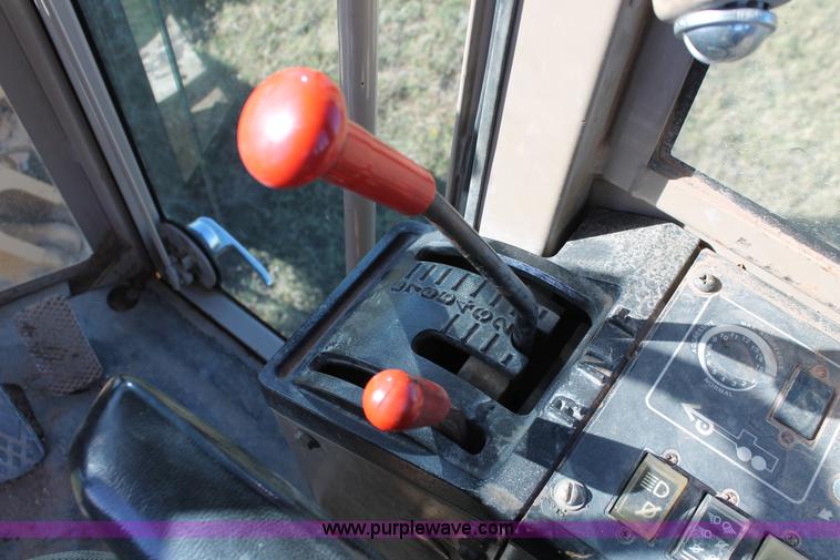 image for item H4211 1995 John Deere 770BH articulated motor grader