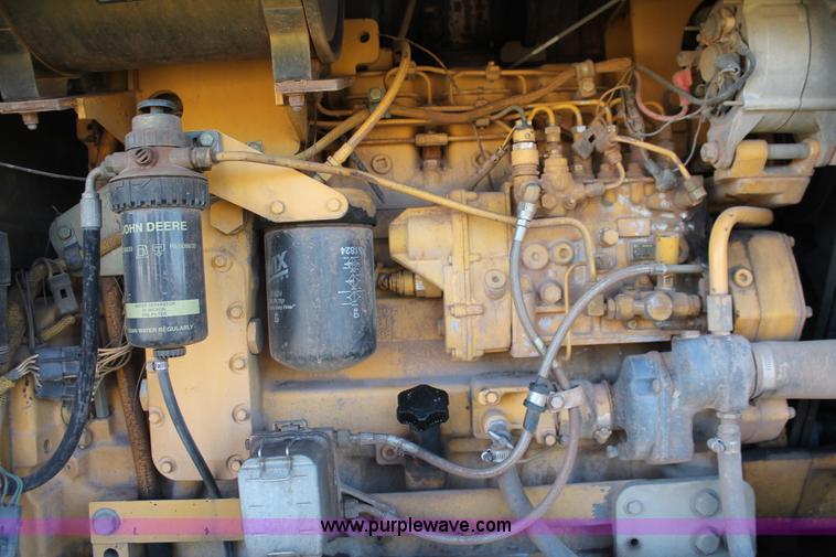image for item H4211 1995 John Deere 770BH articulated motor grader