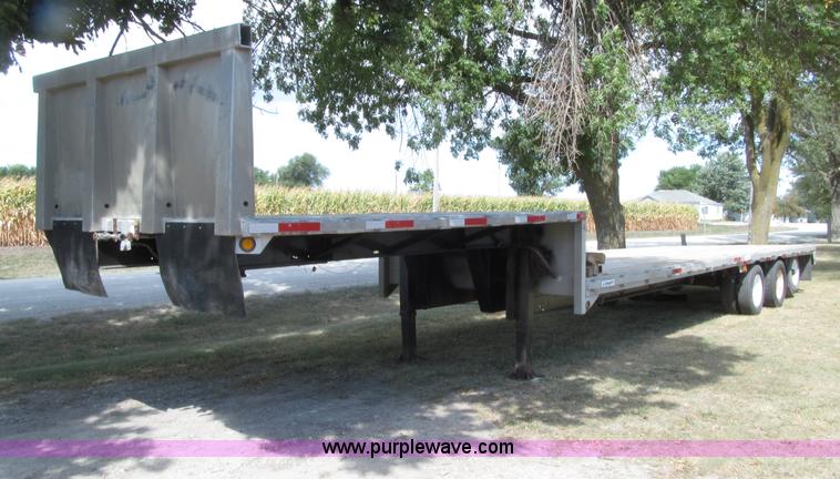 image for item E4638 2012 shop built triple axle step deck equipment trailer