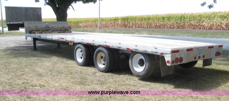 image for item E4638 2012 shop built triple axle step deck equipment trailer
