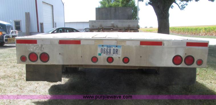 image for item E4638 2012 shop built triple axle step deck equipment trailer