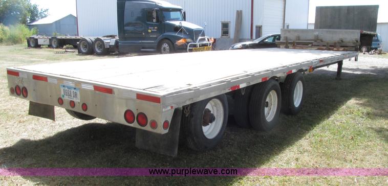 image for item E4638 2012 shop built triple axle step deck equipment trailer