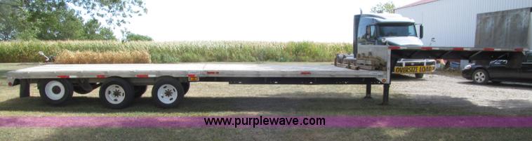 image for item E4638 2012 shop built triple axle step deck equipment trailer