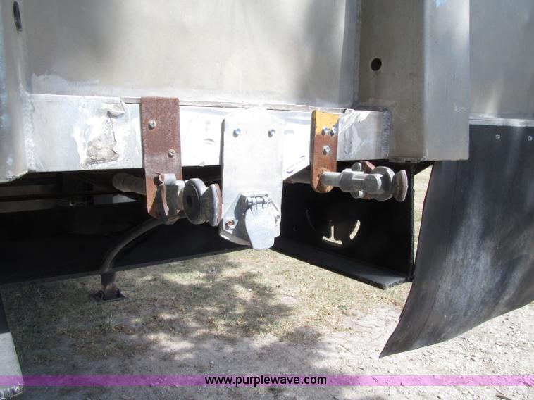 image for item E4638 2012 shop built triple axle step deck equipment trailer