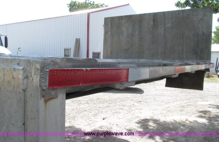 image for item E4638 2012 shop built triple axle step deck equipment trailer