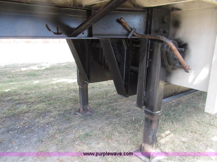 image for item E4638 2012 shop built triple axle step deck equipment trailer