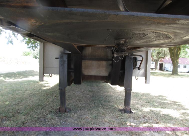 image for item E4638 2012 shop built triple axle step deck equipment trailer