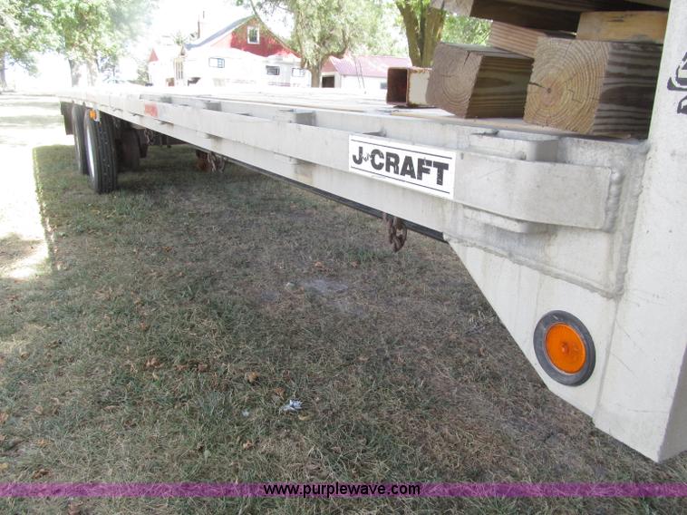 image for item E4638 2012 shop built triple axle step deck equipment trailer