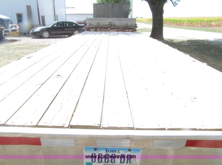 image for item E4638 2012 shop built triple axle step deck equipment trailer