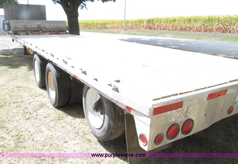 image for item E4638 2012 shop built triple axle step deck equipment trailer