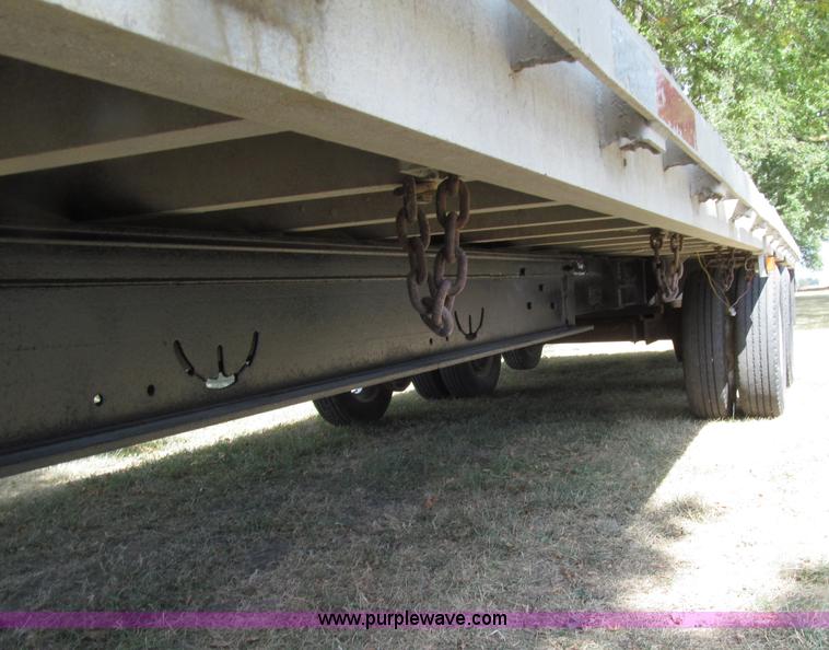 image for item E4638 2012 shop built triple axle step deck equipment trailer