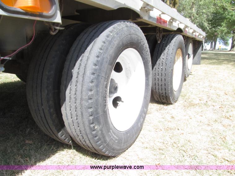 image for item E4638 2012 shop built triple axle step deck equipment trailer