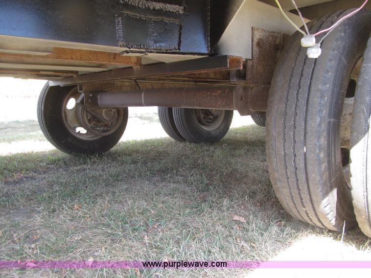 image for item E4638 2012 shop built triple axle step deck equipment trailer
