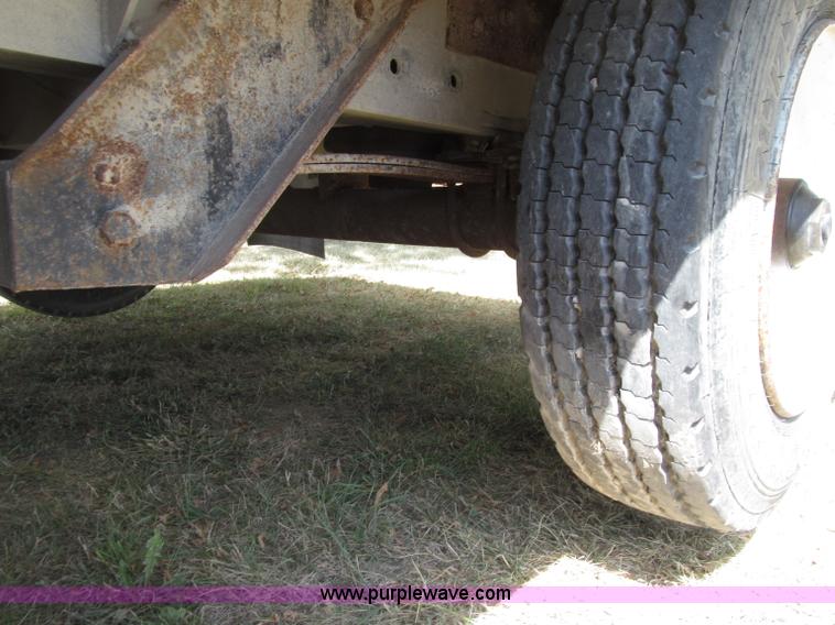 image for item E4638 2012 shop built triple axle step deck equipment trailer