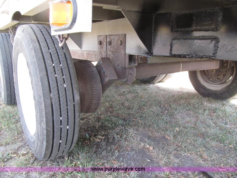 image for item E4638 2012 shop built triple axle step deck equipment trailer