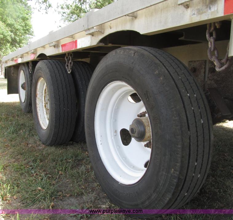 image for item E4638 2012 shop built triple axle step deck equipment trailer