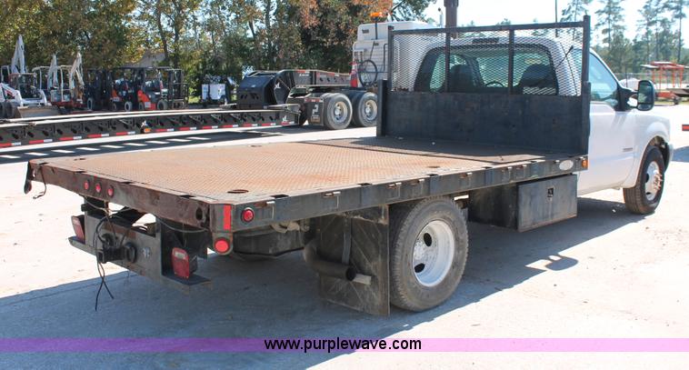 image for item H8392 2003 Ford F350 Super Duty XL stake truck