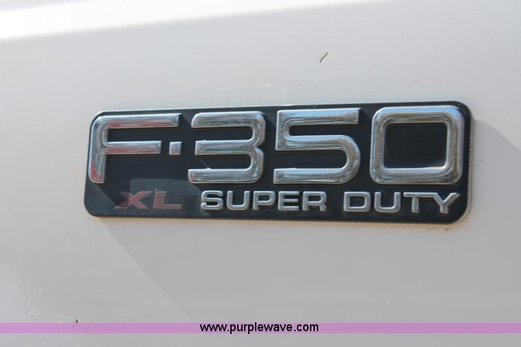 image for item H8392 2003 Ford F350 Super Duty XL stake truck