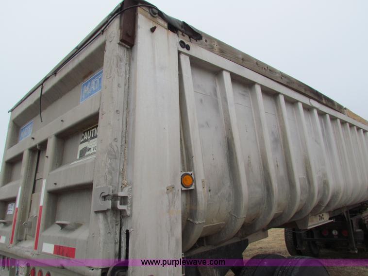 image for item G4376 1980 shop built 28' aluminum barrel end dump trailer