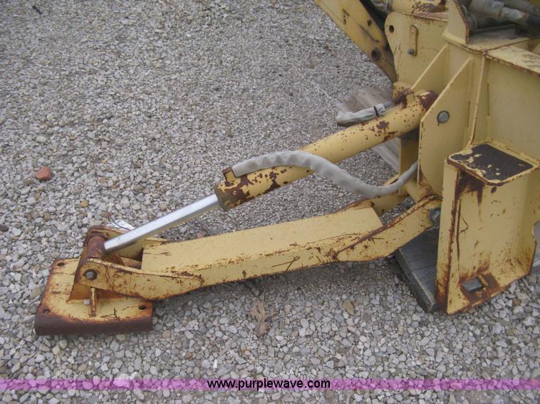 image for item H4343 John Deere Pro 911 Extender skid steer backhoe attachment