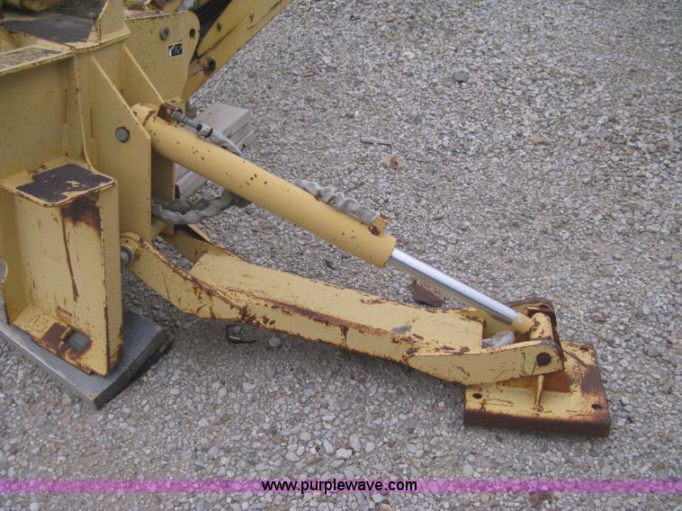 image for item H4343 John Deere Pro 911 Extender skid steer backhoe attachment