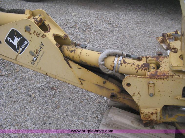 image for item H4343 John Deere Pro 911 Extender skid steer backhoe attachment