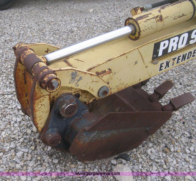 image for item H4343 John Deere Pro 911 Extender skid steer backhoe attachment